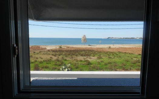 For sale in Aktio, a newly built house with an area of 120 sqm, built on a plot of 600 sqm corner in front of the sea – beach
